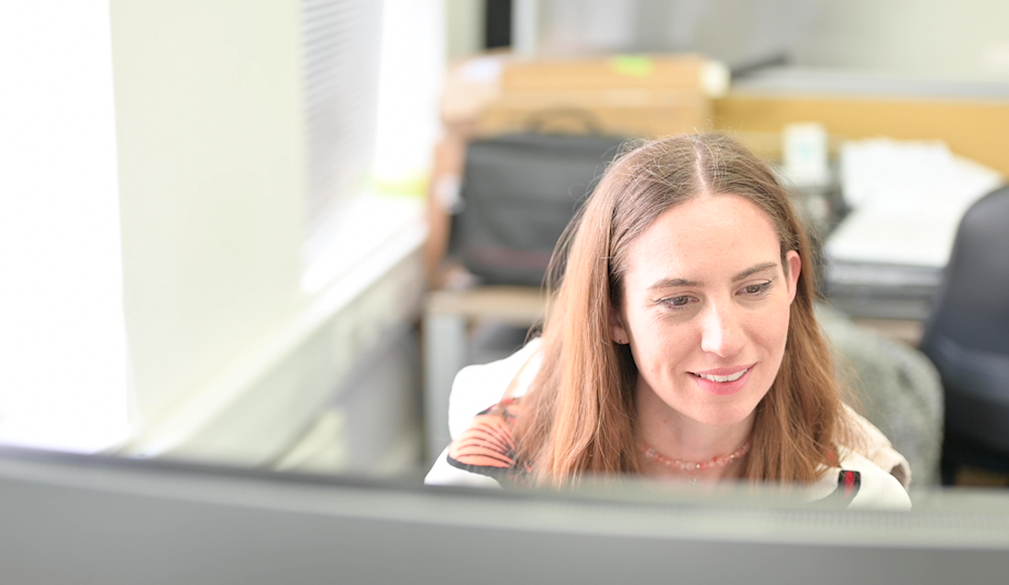 Katherine at desk - The superfast team